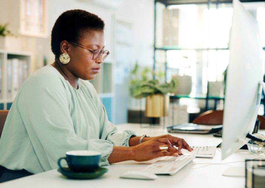 black-woman-office-and-computer-with-typing-and-b-2026-01-09-11-22-23-utc
